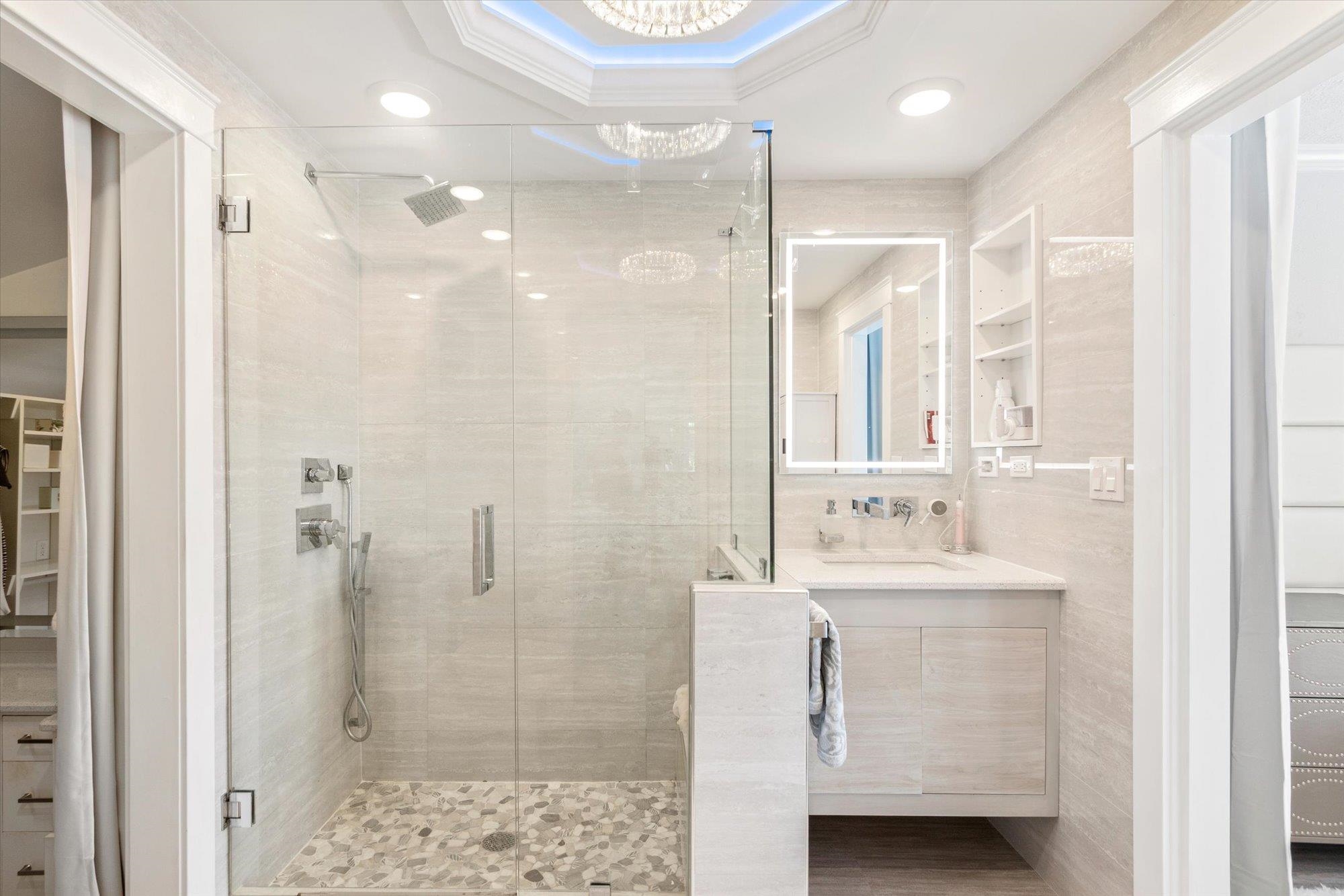 78 Ferrol Road St. Augustine, FL 32084 - Photo 22 of 59 a bathroom with a shower a sink a mirror and a shower