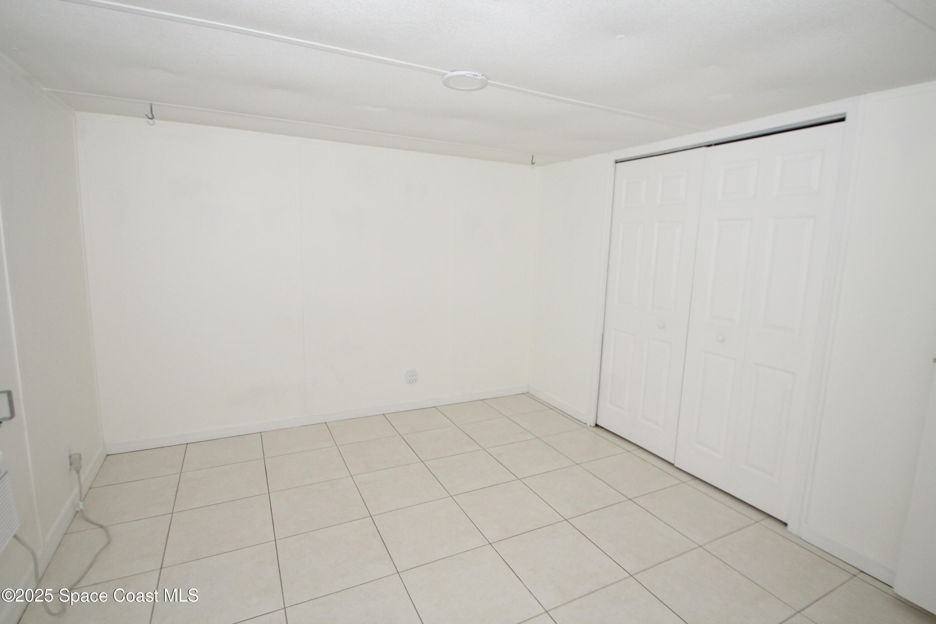 2132 Rocway Drive Melbourne, FL 32935 - Photo 6 of 8 a view of an empty room
