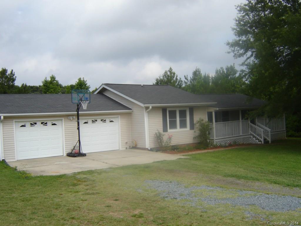 1007 Mills Harris Road Wingate, NC 28174 - Photo 1 of 24 front view of house with a yard