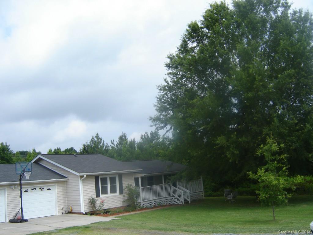 1007 Mills Harris Road Wingate, NC 28174 - Photo 2 of 24 a front view of a house with garden
