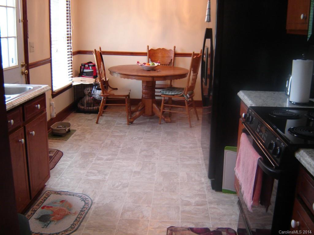 1007 Mills Harris Road Wingate, NC 28174 - Photo 11 of 24 a view of a balcony and chairs