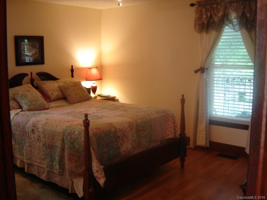 1007 Mills Harris Road Wingate, NC 28174 - Photo 13 of 24 a bedroom with a bed and a window