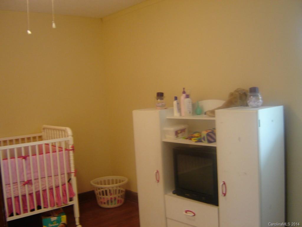 1007 Mills Harris Road Wingate, NC 28174 - Photo 17 of 24 a bathroom with a sink and toilet