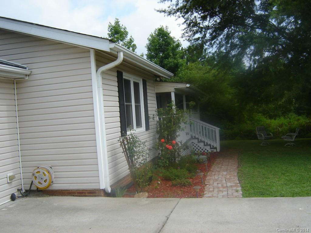 1007 Mills Harris Road Wingate, NC 28174 - Photo 3 of 24 a view of a house with backyard and garden