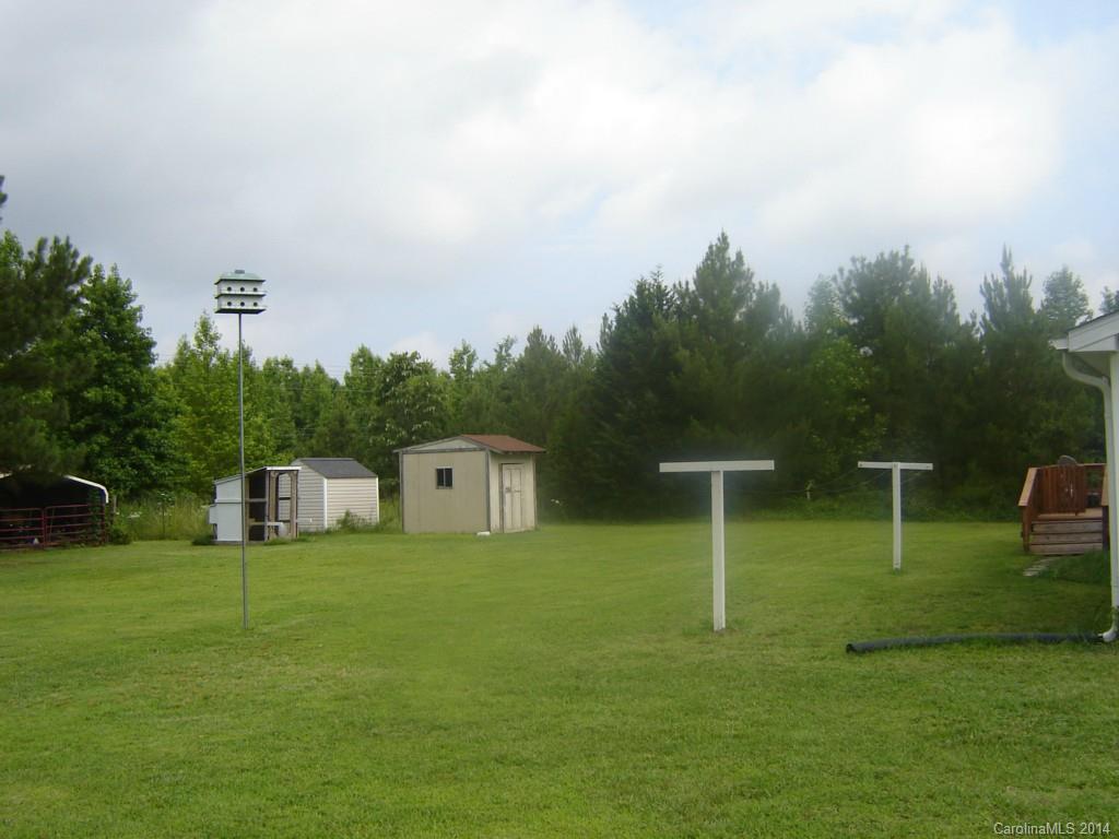1007 Mills Harris Road Wingate, NC 28174 - Photo 23 of 24 a view of a house with a backyard