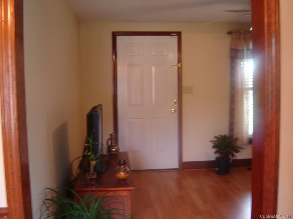 1007 Mills Harris Road Wingate, NC 28174 - Photo 6 of 24 a view of a room with a potted plant