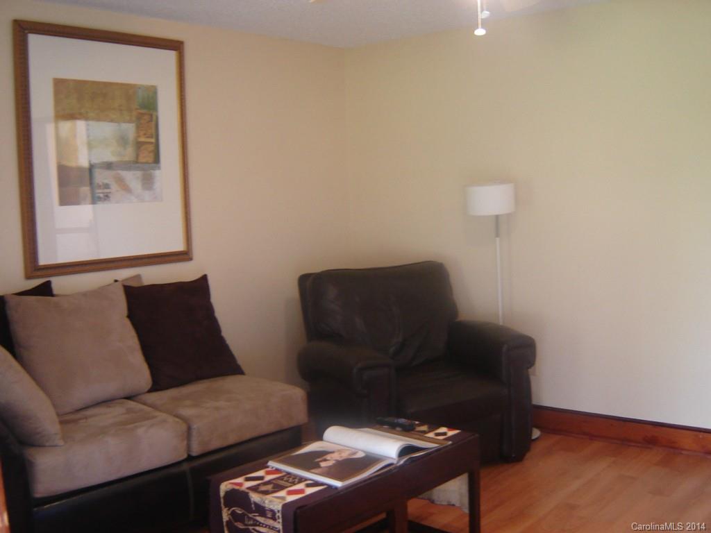 1007 Mills Harris Road Wingate, NC 28174 - Photo 7 of 24 a living room with furniture and a window