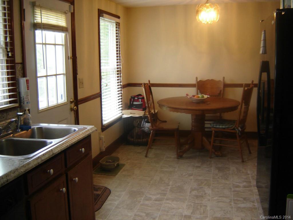 1007 Mills Harris Road Wingate, NC 28174 - Photo 10 of 24 a kitchen with a sink and a window