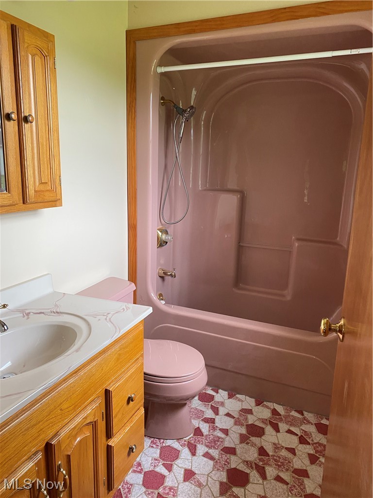 36889 Capel Road Grafton, OH 44044 - Photo 17 of 26 Bathroom featuring vanity, toilet, and shower / washtub combination