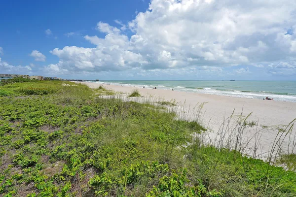 a living room with patio furniture