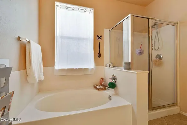 a white bath tub sitting next to a bathroom