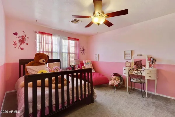 a bedroom with furniture and a window