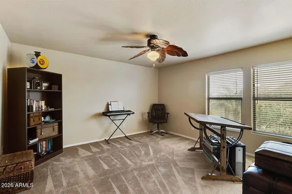 a bedroom with furniture and a window