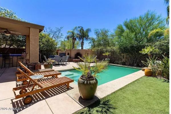 a view of a backyard with sitting area