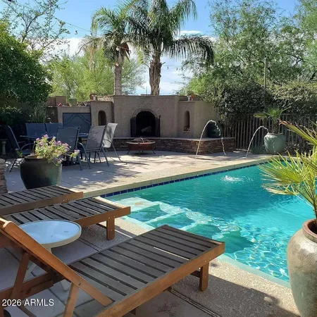 a view of a backyard with sitting area