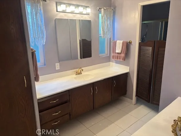 a bathroom with a double vanity sink a and mirror