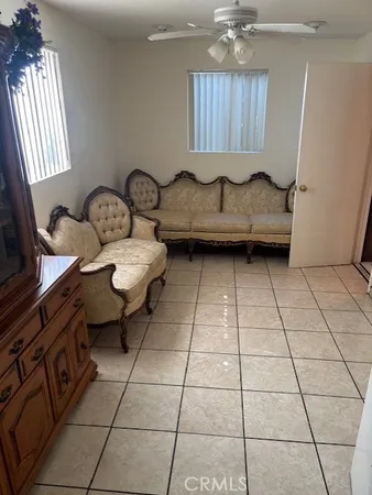 a bathroom with a sink toilet and window