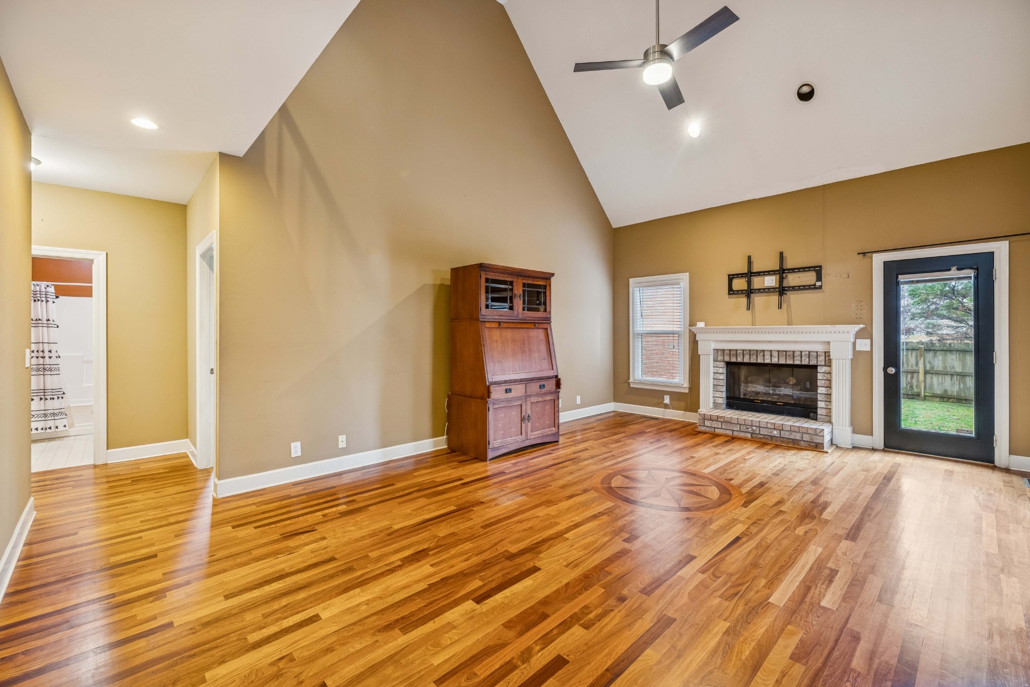 2815 Bowers Lane Murfreesboro, TN 37129 - Photo 26 of 75 a view of empty room with wooden floor and fireplace