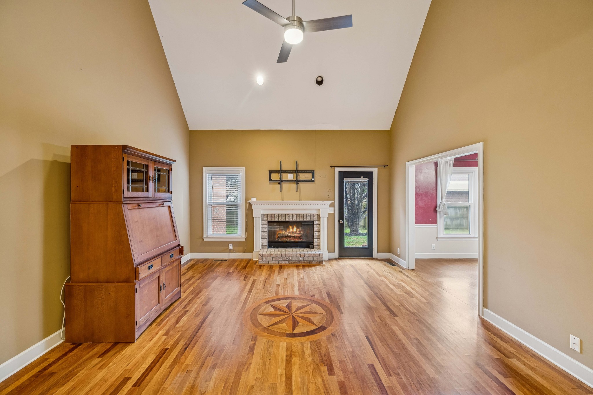 2815 Bowers Lane Murfreesboro, TN 37129 - Photo 29 of 75 a view of livingroom with fireplace wooden floor and window