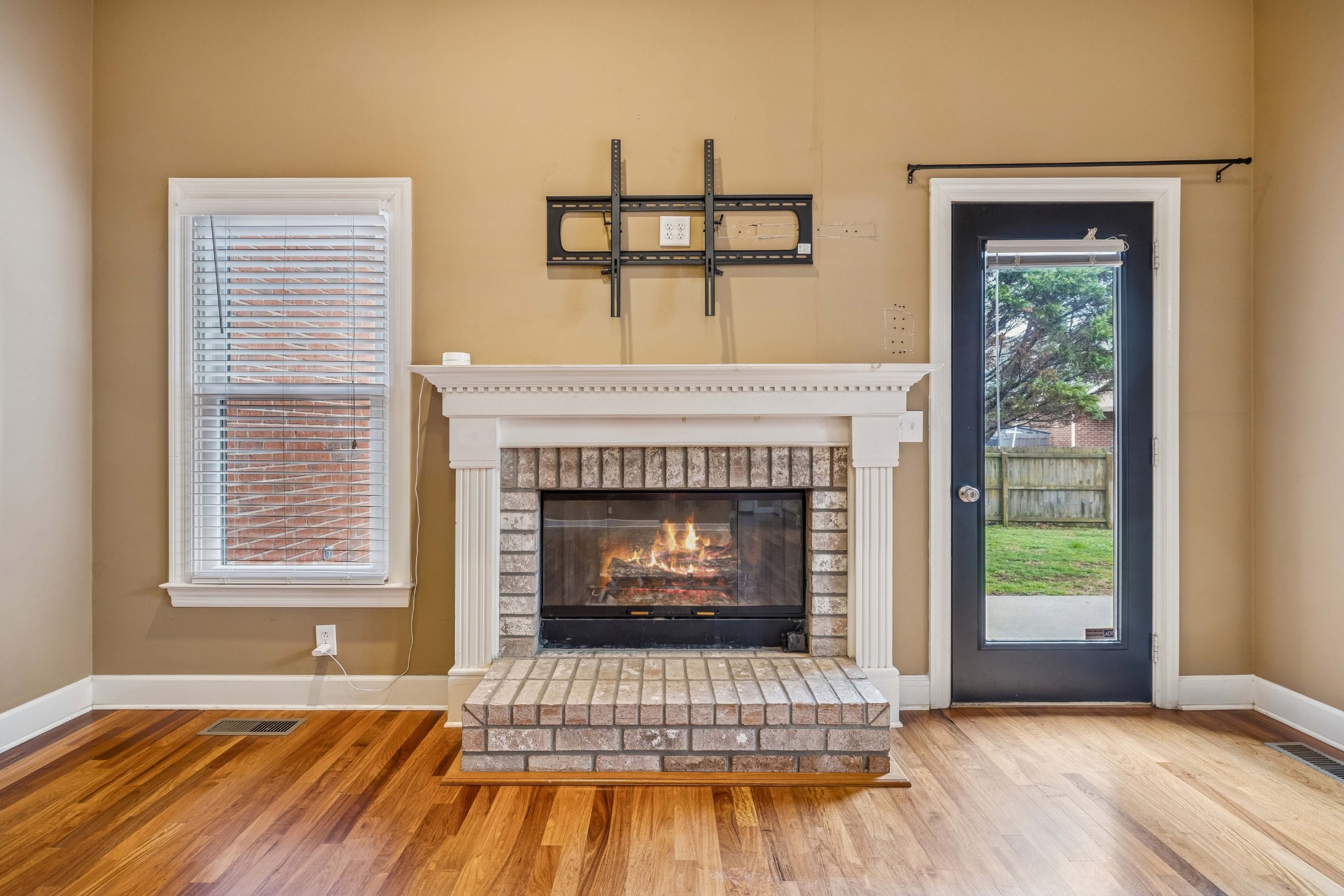 2815 Bowers Lane Murfreesboro, TN 37129 - Photo 32 of 75 a living room with a fireplace and wooden floor