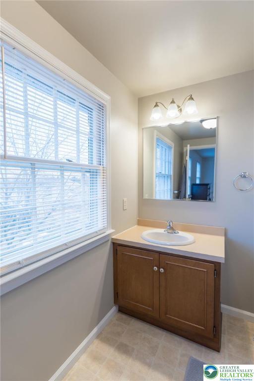 1049 Barnside Road Allentown, PA 18103 - Photo 11 of 19 a bathroom with a sink and a window