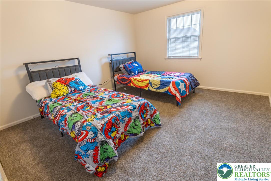 1049 Barnside Road Allentown, PA 18103 - Photo 13 of 19 a bedroom with two beds and a window