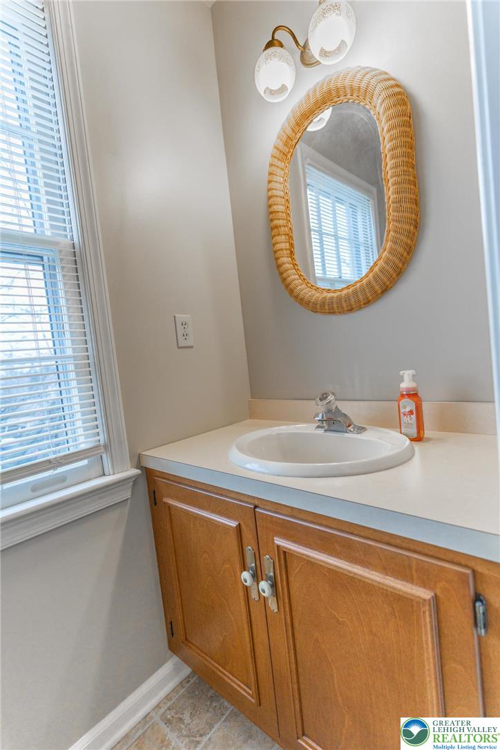 1049 Barnside Road Allentown, PA 18103 - Photo 8 of 19 a bathroom with a sink and a mirror