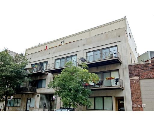 14 North Sangamon Street, Unit 303 Chicago, IL 60607 - Photo 1 of 1 a front view of a house with plants and entryway