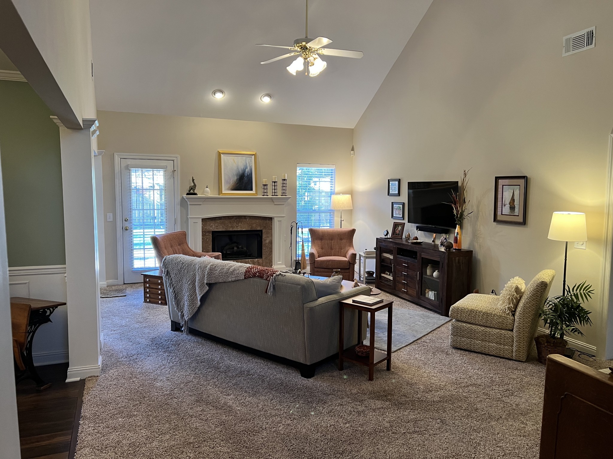3139 Vera Valley Road Franklin, TN 37064 - Photo 2 of 6 a living room with furniture a fireplace and a flat screen tv