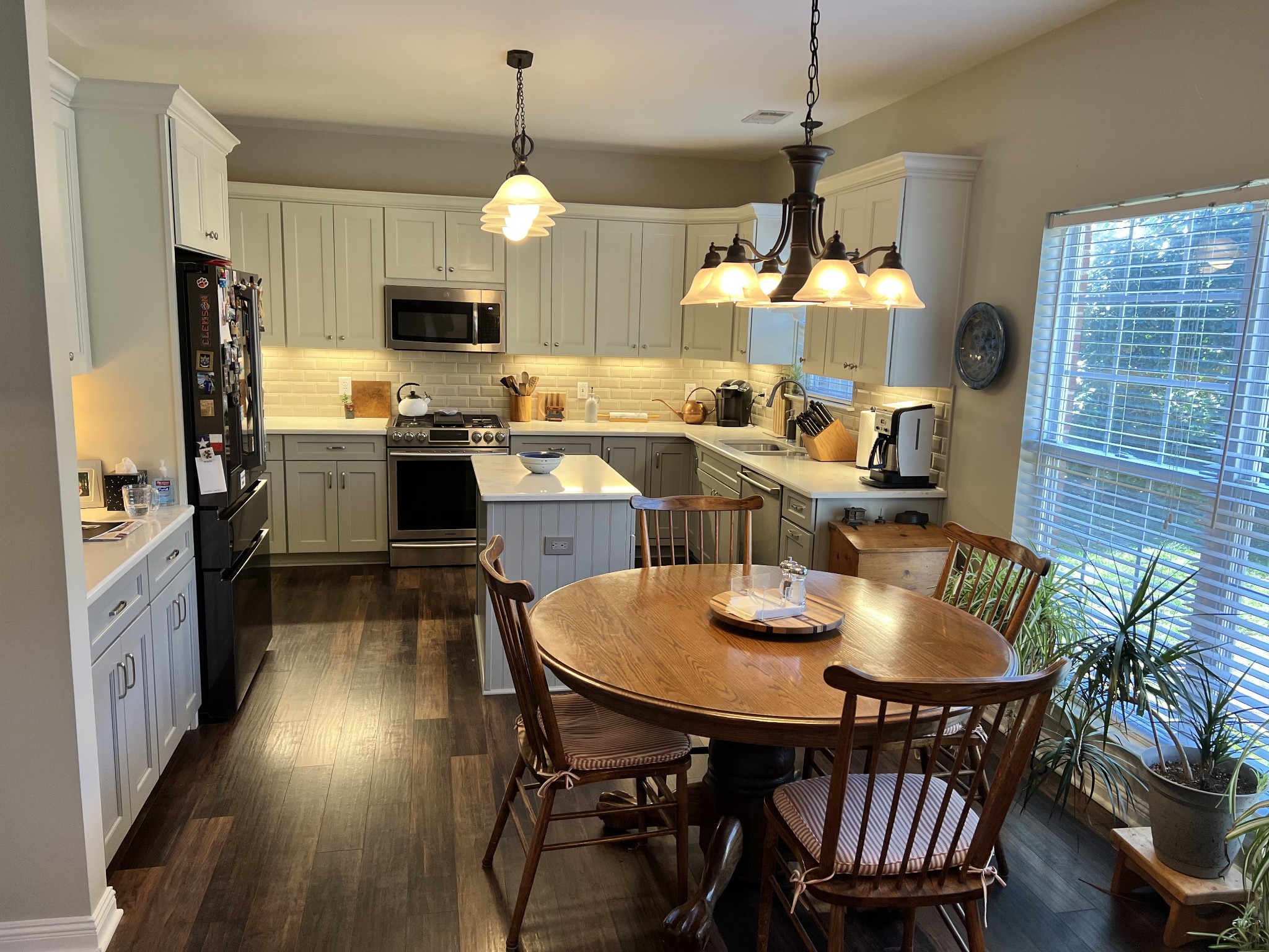3139 Vera Valley Road Franklin, TN 37064 - Photo 3 of 6 a kitchen with sink a refrigerator and chairs