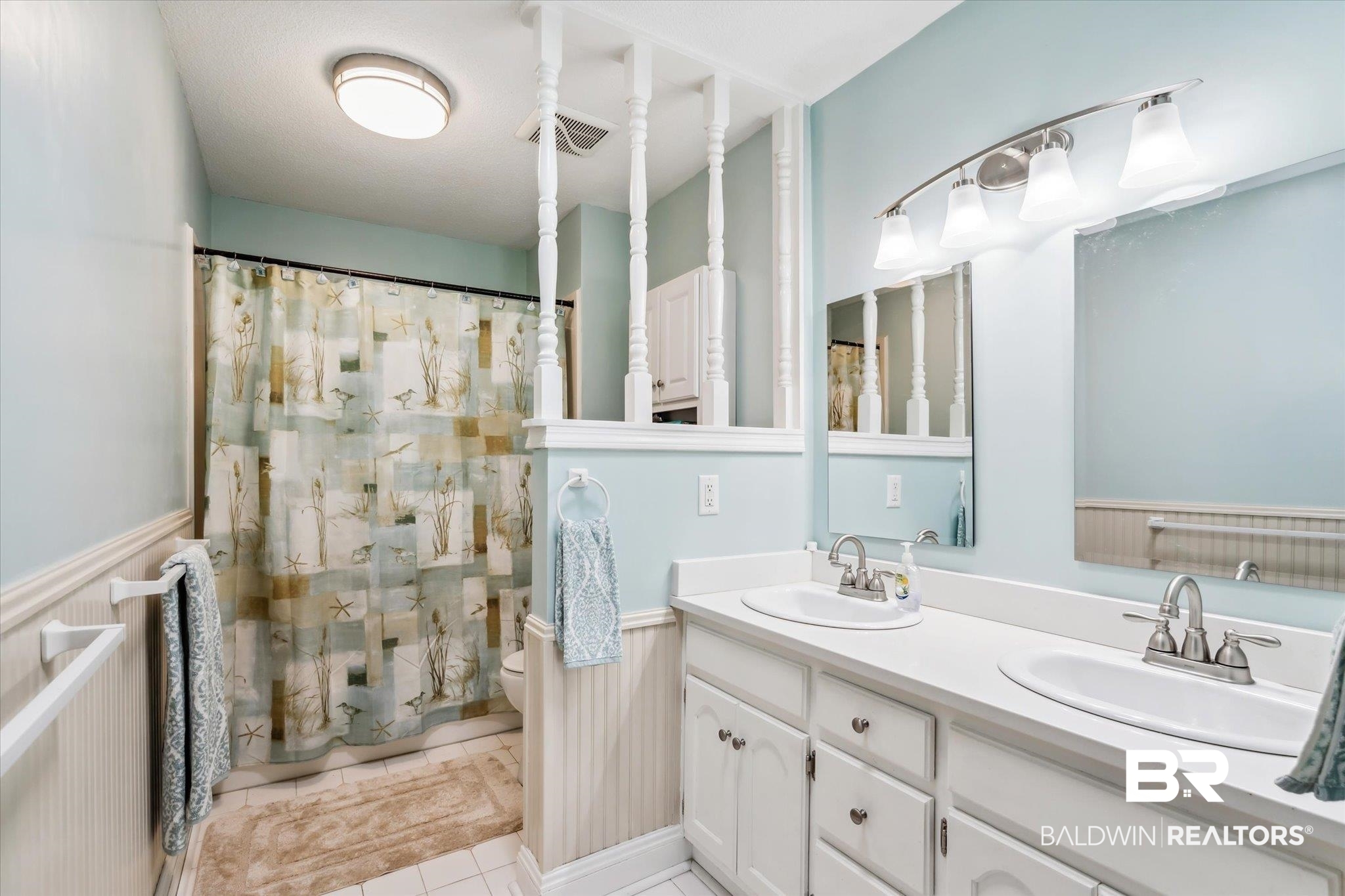 8710 Three Notch Road Mobile, AL 36619 - Photo 18 of 30 Bathroom with double vanity, tile patterned flooring, and toilet
