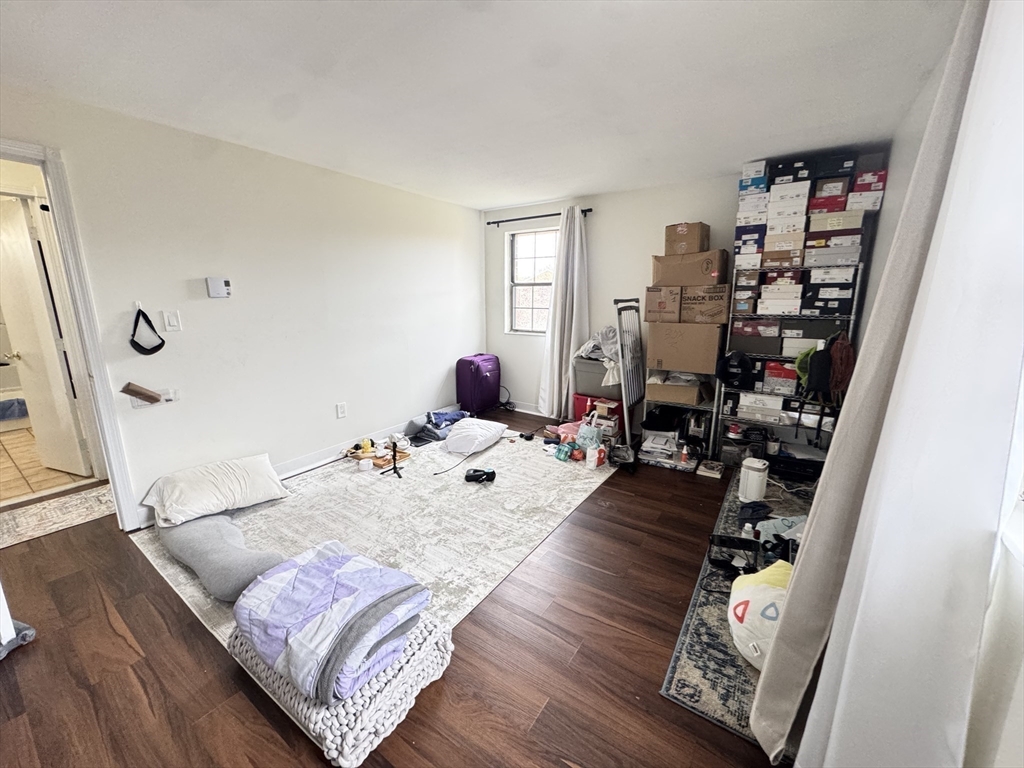 14 A Mayberry Drive, Unit 10 Westborough, MA 01581 - Photo 15 of 25 a bedroom with a bed and a large window