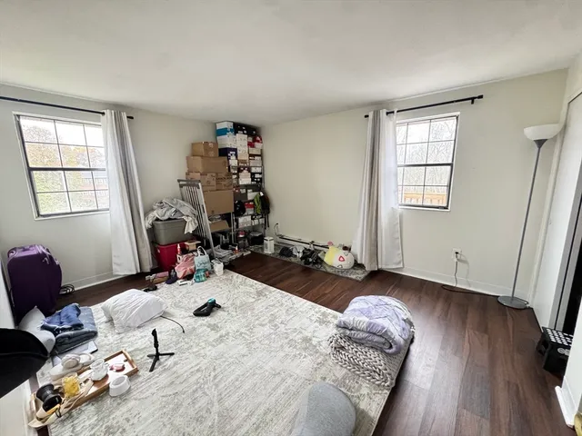 a bed room with a bed and a window