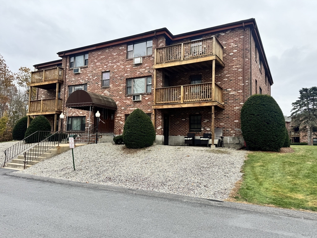 14 A Mayberry Drive, Unit 10 Westborough, MA 01581 - Photo 23 of 25 a view of building with car parked