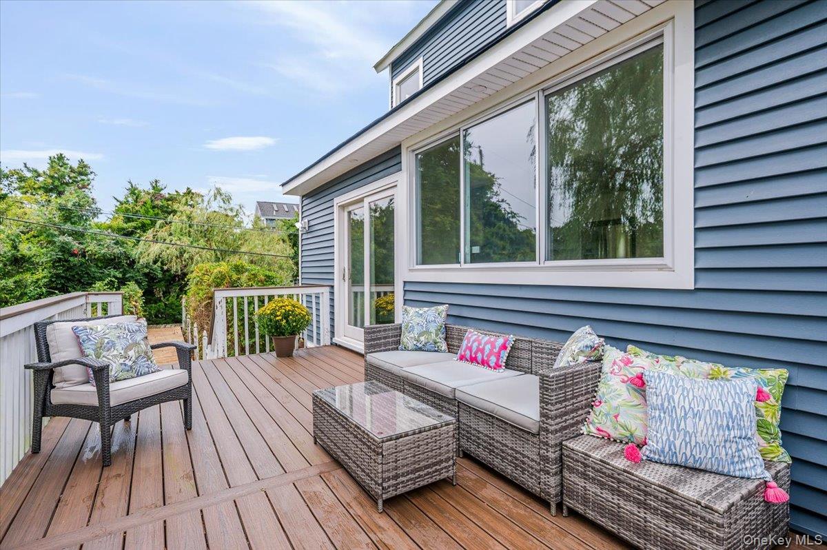 56 Oak Beach Road Babylon, NY 11702 - Photo 26 of 30 Step out to your private outdoor sanctuary featuring a brand new Trex deck which is maintenance free so you can enjoy hosting friends and family.