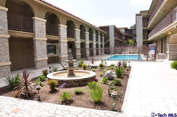 a front view of a building with outdoor seating