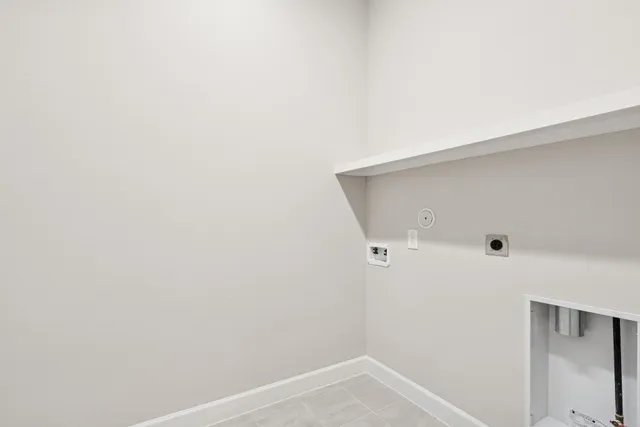 a view of a kitchen with a sink and a refrigerator