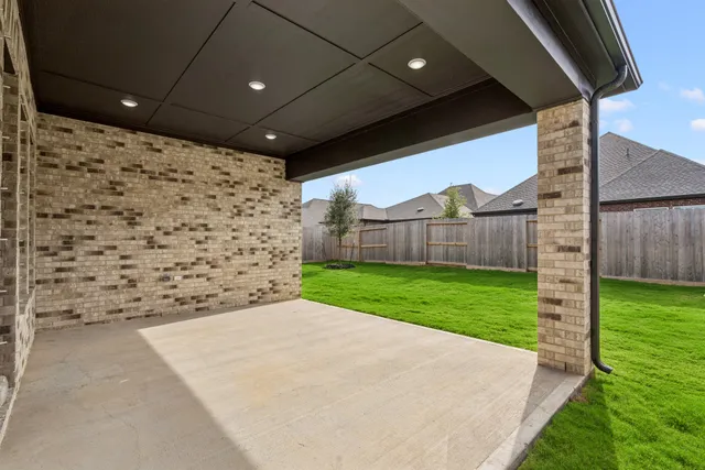 a view of a house with a yard and porch