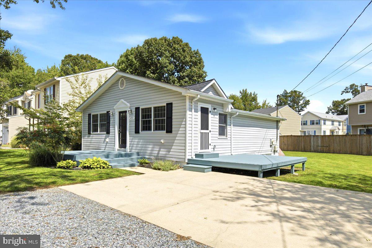 Front of House with Driveway and decks