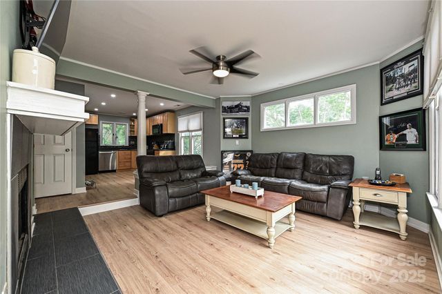 a living room with furniture and a fireplace