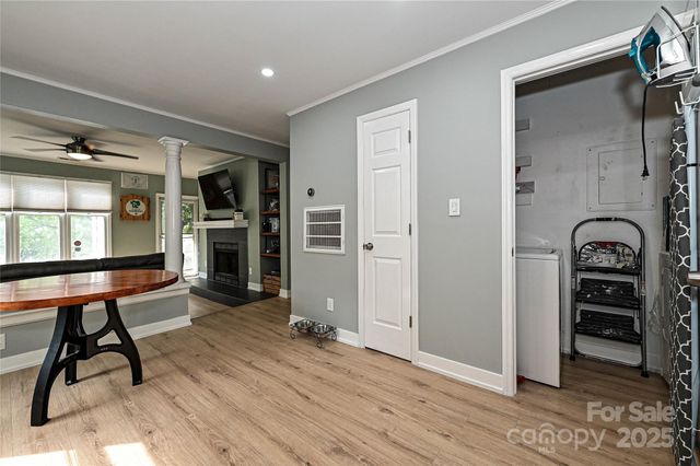 a view of an entryway with wooden floor