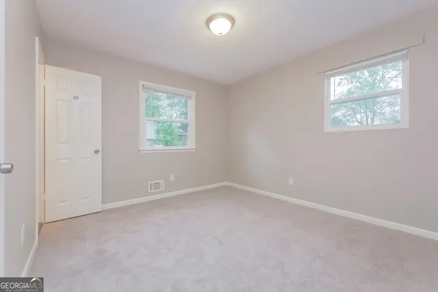 an empty room with windows
