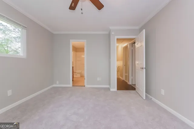 an empty room with windows and closet