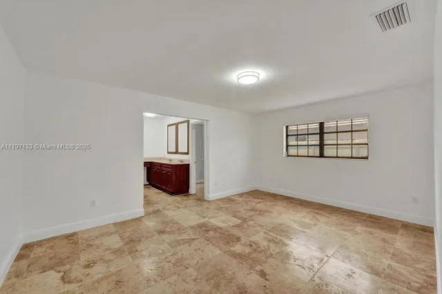 a bathroom with a shower a toilet and sink