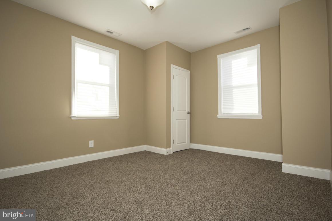 1517 Northgate Road Baltimore, MD 21218 - Photo 22 of 25 an empty room with windows