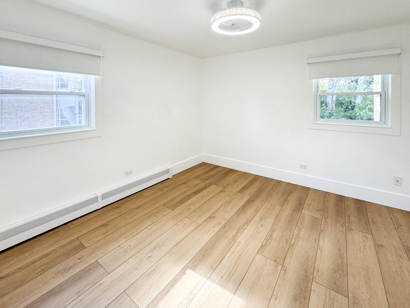 332 North Smith Street, Unit 1 Palatine, IL 60067 - Photo 11 of 17 a view of empty room with wooden floor and fan