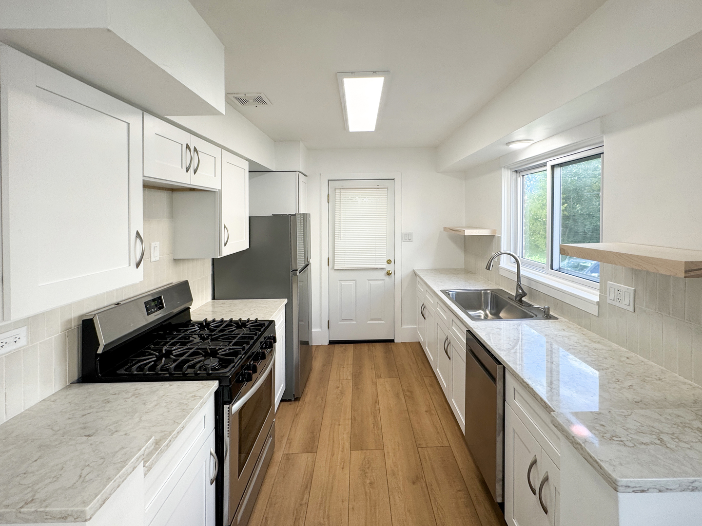 332 North Smith Street, Unit 1 Palatine, IL 60067 - Photo 4 of 17 a large kitchen with a stove and a sink