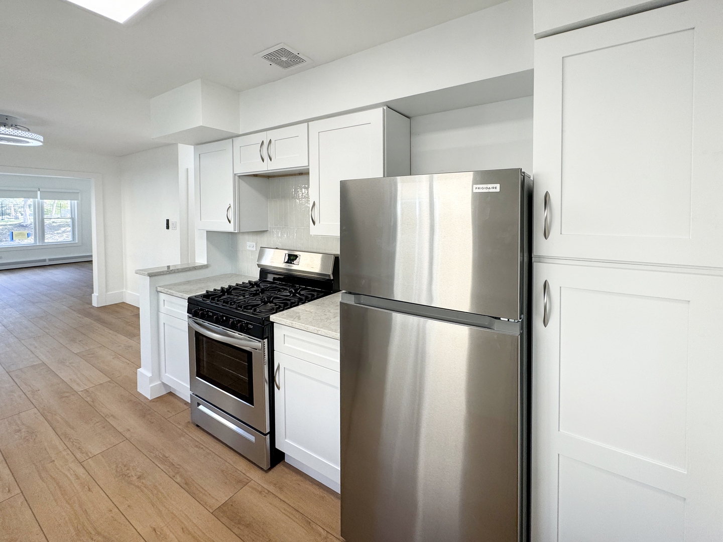 332 North Smith Street, Unit 1 Palatine, IL 60067 - Photo 5 of 17 a white refrigerator freezer sitting inside of a kitchen