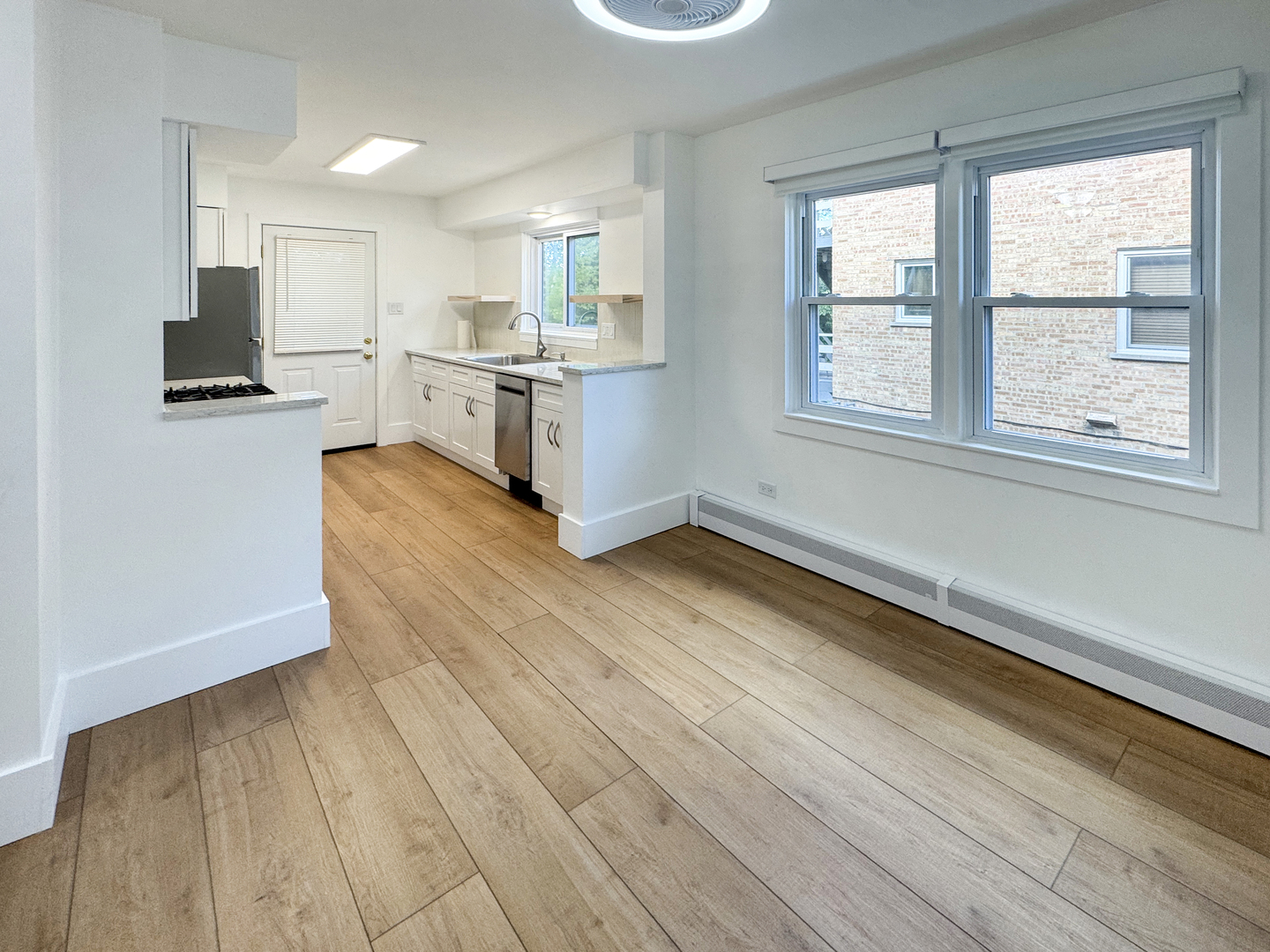 332 North Smith Street, Unit 1 Palatine, IL 60067 - Photo 7 of 17 a kitchen with stainless steel appliances granite countertop a stove and a sink