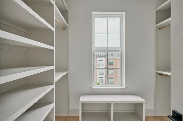 a room that has a window and a cabinet